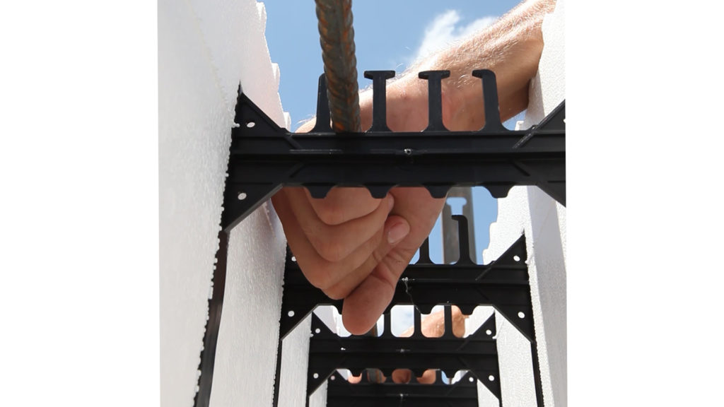 Placing rebar in the plastic webs that connect BuildBlock ICFs