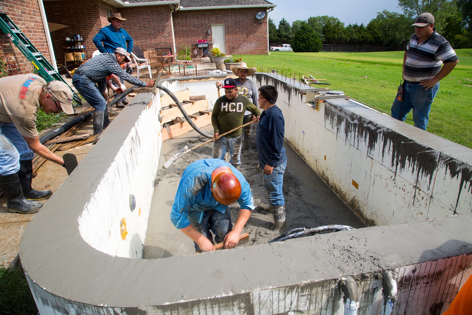 Pouring concrete for an ICF pool.