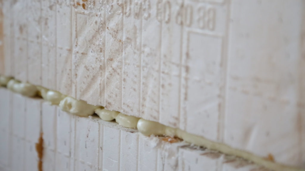Foam adhesive keeps the wire in place inside the ICF chase