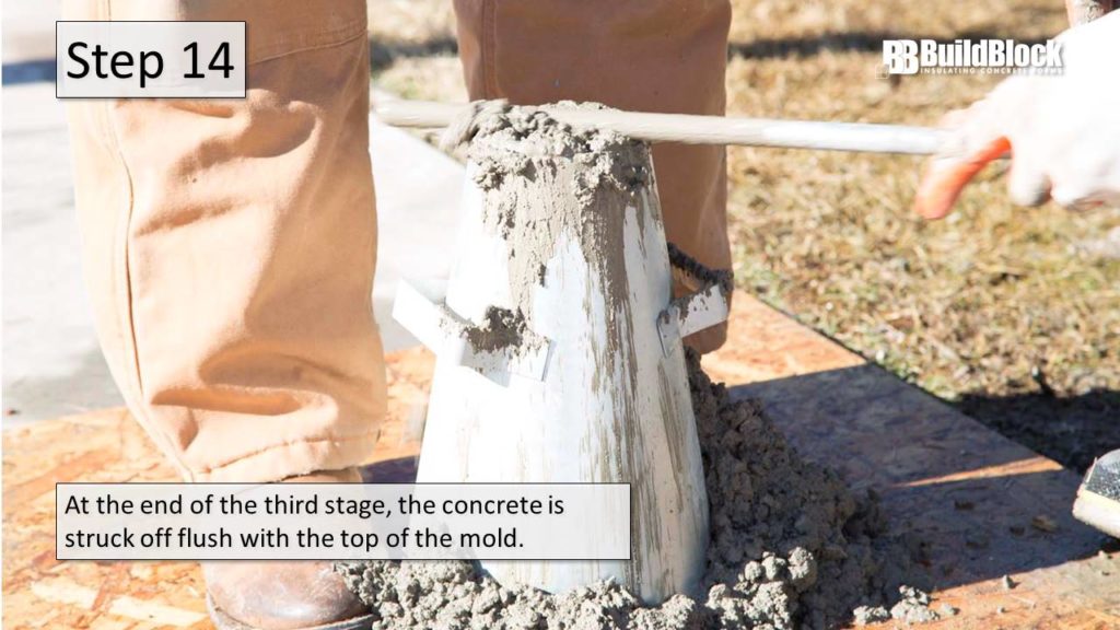 Step 14: At the end of the third state, the concrete is struck off flush with the top of the mold.