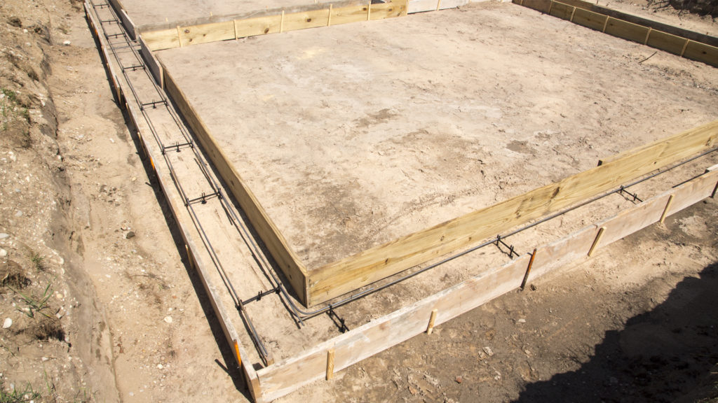 Footings before the pour, complete with rebar in rebar chairs