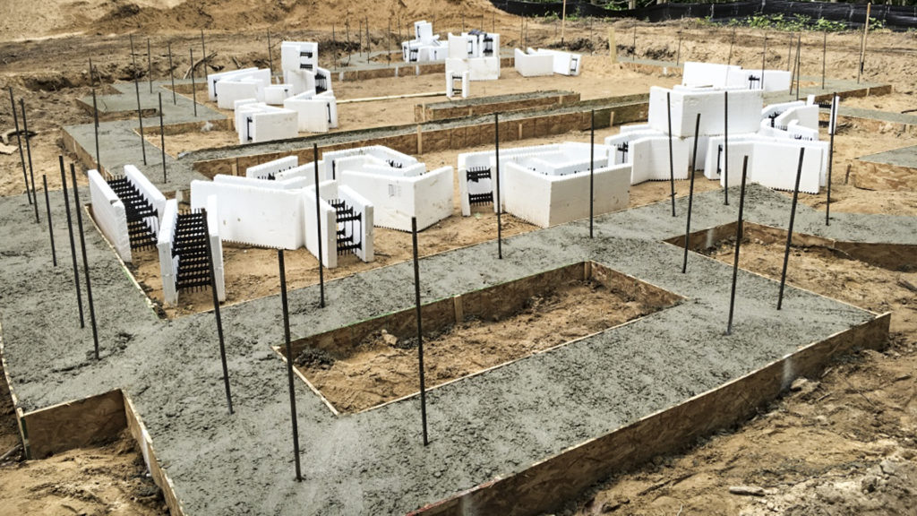Rebar pins extending from the footing